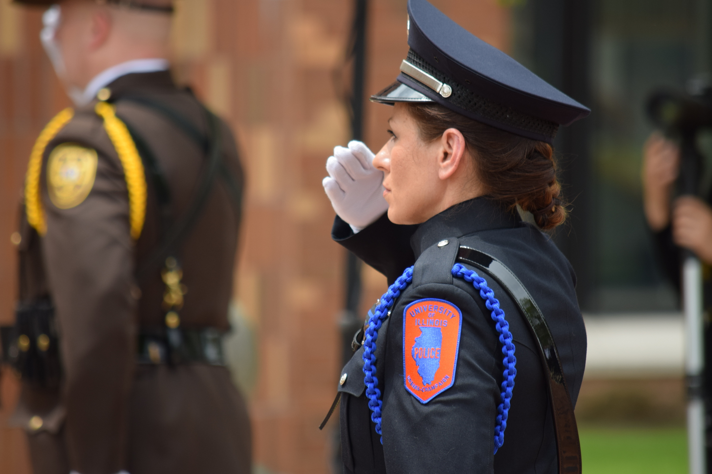 Sergeant Michelle Schroeder offers a salute during the 2019 police memorial ceremony outside the Champaign County courthouse.