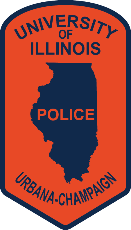UIPD shoulder patch -- a vertically-oriented, orange pointed ellipse with a blue state of Illinois in the middle, surrounded by the words University of Illinois Urbana-Champaign Police.