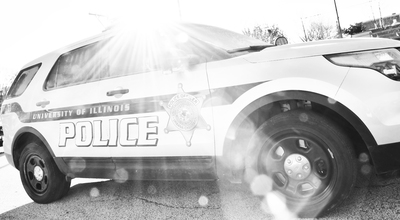 Black and white photo of a UIPD squad car.