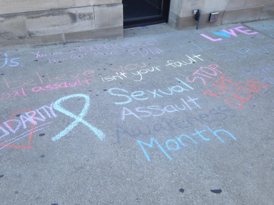 Chalk messages outside the University of Illinois Women's Resources Center.