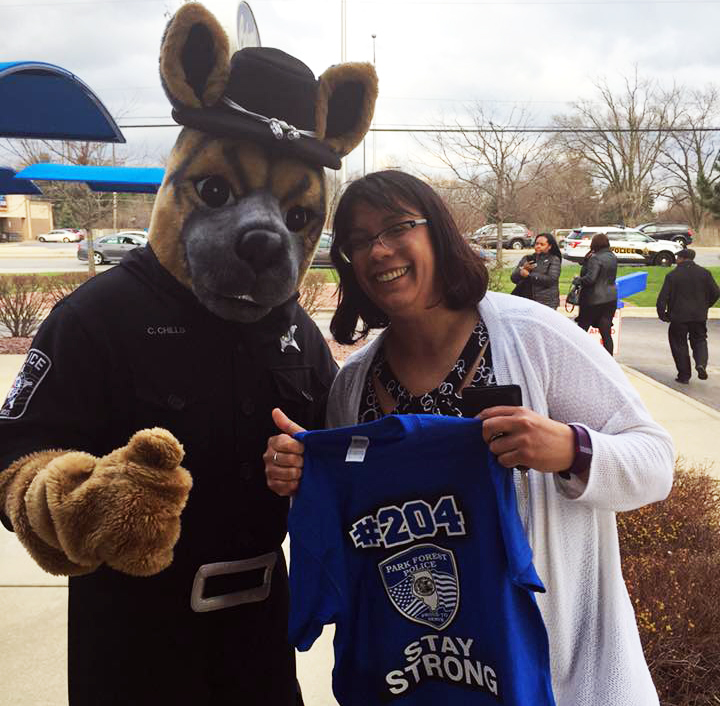 Lt. Joan Fiesta with the mascot from the County Club Hills, Illinois, Police Department mascot.