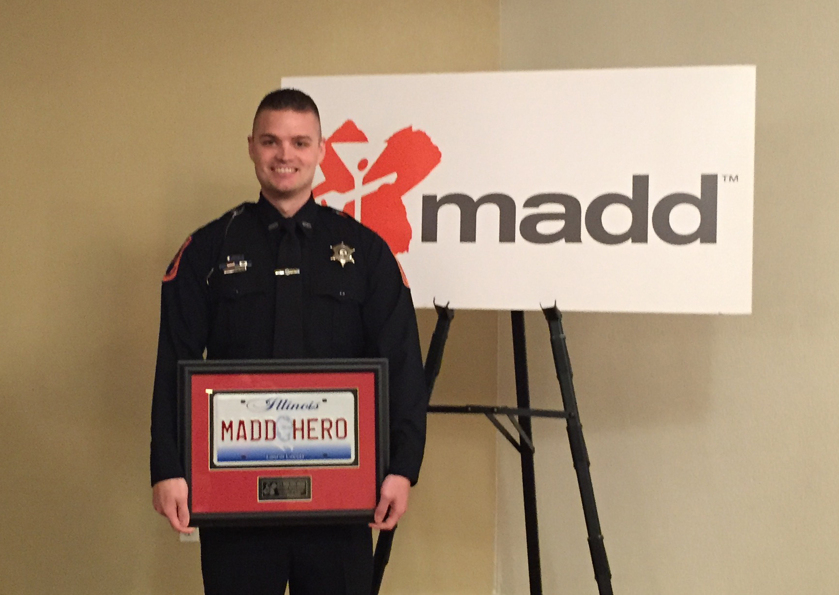 U. of I. Police Officer Ryan Snow being honored by Mothers Against Drunk Driving as a 