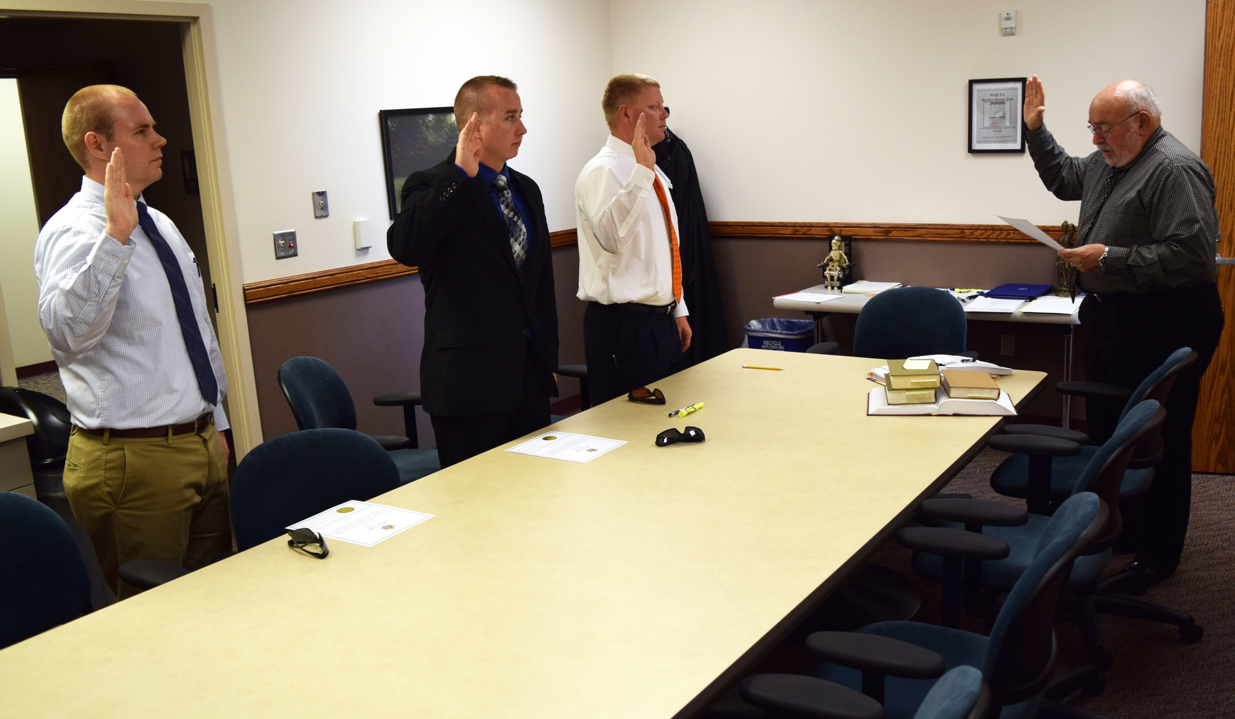 Drew Osterholt, Dylan Short and Tyrel Ledbetter taking their oaths of office.