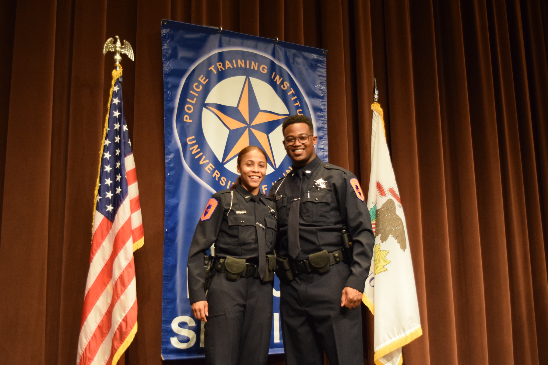 Officer Nina Thigpen and Officer Malik Harrison graduating from the University of Illinois Police Training Institute